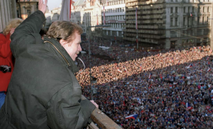 Vaclav Havel waves to a crowd of thousands of demonstrators gathered on Prague’s Wenceslas Square on 10 December 1989. After the Velvet Revolution, Havel served as the last president of Czechoslovakia and then the first president of the Czech Republic. Photograph: Lubomir Kotek/AFP 